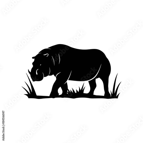 A black silhouette of a hippopotamus walking through tall grass, depicted in a simple, graphic style.