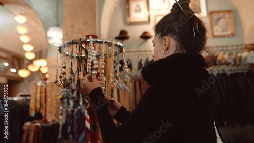 caucasian woman antique collector examining vintage charms