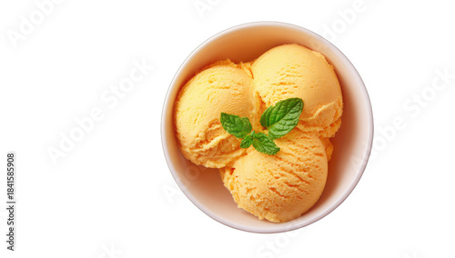 A pale orange dessert with mint leaves in a white bowl against a black background