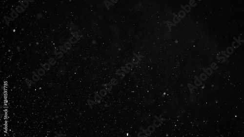 3d handmade render. Seamless footage, VFX Blizzard Realistic Snow Storm Overlay Endless Loop. Chaotic High-Density Falling white translucent Dust Particles on a black background.