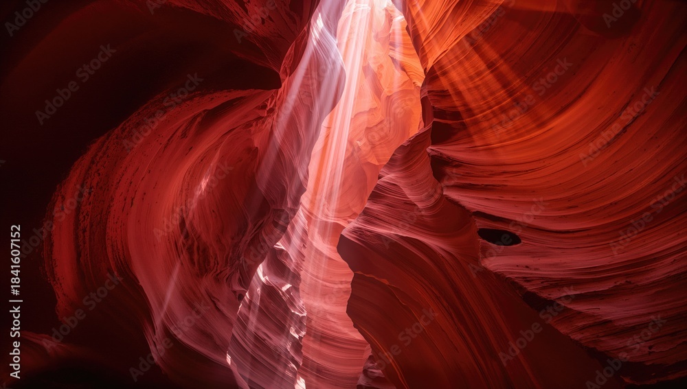 Fototapeta premium Light-filtered view of Antelope Canyon showcasing vibrant orange rock formations, ideal for nature-themed layouts,