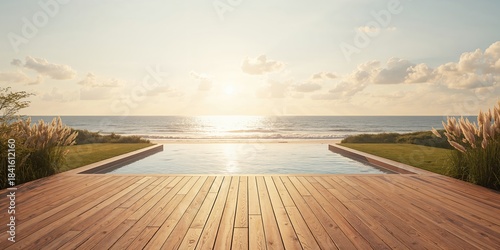 Empty exterior wooden deck overlooking a pool and lawn at a modern coastal villa, suitable for outdoor relaxation