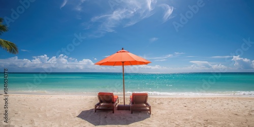 Lounge chairs and umbrella ...