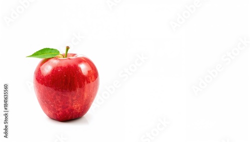 Red apple positioned agains...