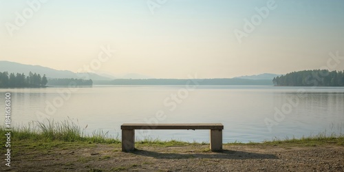 A bench facing a lakeside l...