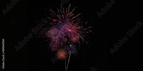 Nighttime fireworks burstin...