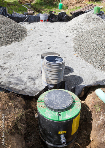 Close up on the pump, filters and  gravel filter bed for a domestic septic tank during  installation, waste water management
