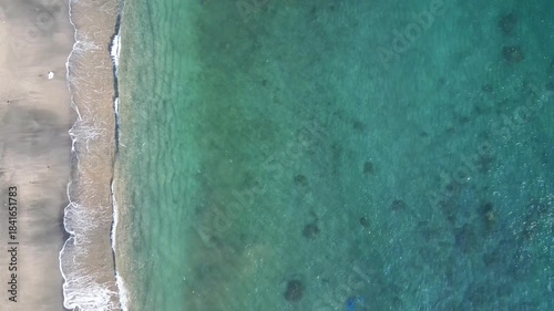 Senggigi beach aerial landscape by drone in Lombok, Indonesia. tropical beach vertical top down view