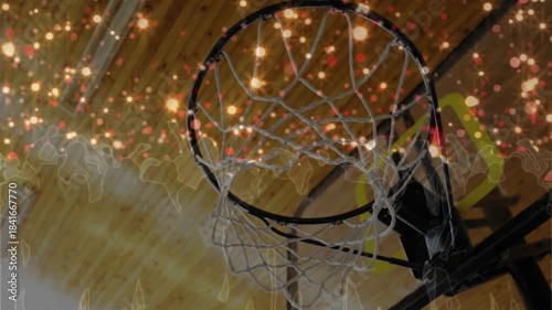 Warm sparkles brightening, rim and net swinging while camera shifting right down centering hoop