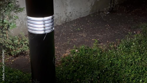 Rain passing by ground light 