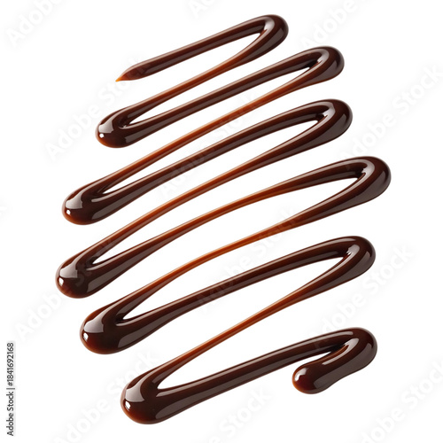 Rich chocolate syrup drizzled in a decorative swirl pattern on a white background