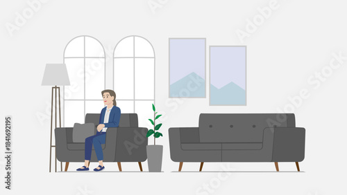 Woman in blue suit sitting on a sofa in a modern waiting room