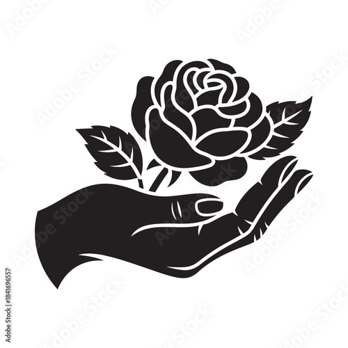 A delicate black rose blossom is held gently within a protecting hand