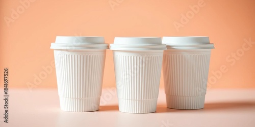 Wallpaper Mural Three textured white paper coffee cups with lids, pastel background, warm lighting,   top view,  lids Torontodigital.ca