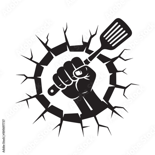 A clenched fist powerfully holding a spatula breaking through a cracked wall