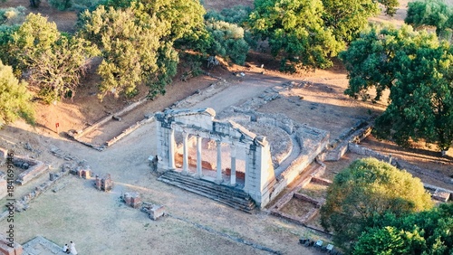 🌿 Wide-angle of stone amphitheater ruins in Apolonia, Albania – golden hour
