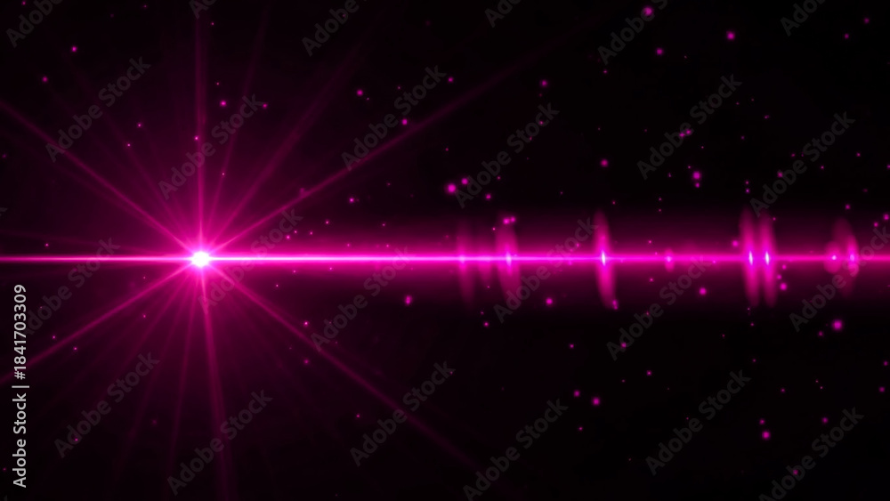 Fototapeta premium A vibrant pink starburst lens flare dominates the left side of the frame, emitting radiant beams across a dark background. Small, glowing pink particles, resembling stars or bokeh, are scattered
