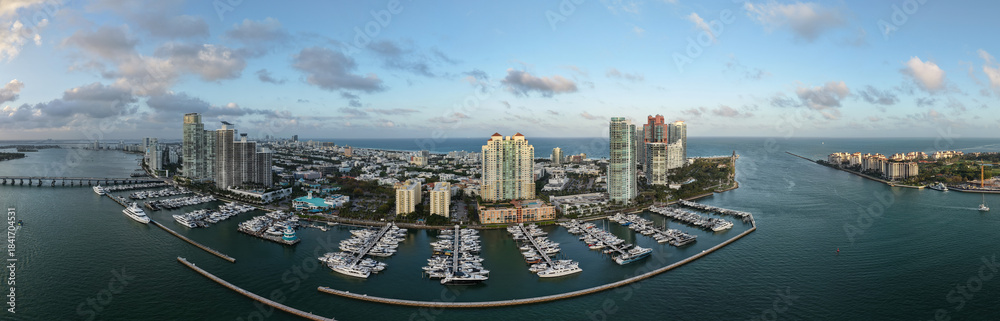 Obraz premium Panorama of Miami from above. Drone view of Miamis famous landmarks. South Pointe beach with skyscrapers. Miami city panorama. Oceanfront skyline of Miami Beach.