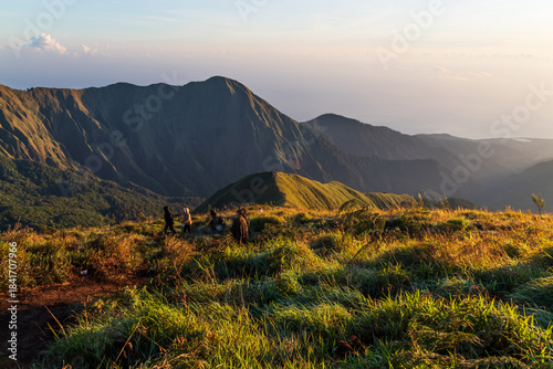 Foto Hikers watching sunrise from Pergasingan Hill Lombok Indonesia