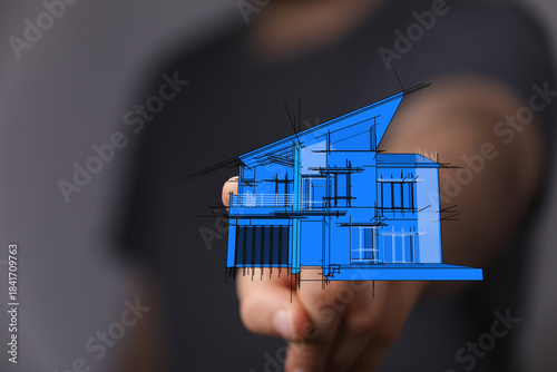 Man holding blueprint of ho...