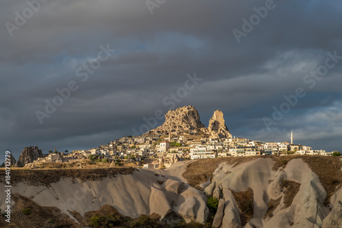 Uçhisar a town in Nevşehir district, Nevşehir province in Cappadocia, Türkiye, under a very dark sky