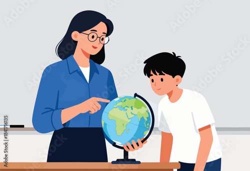 Instructor guides student with a globe on a wooden desk in a classroom