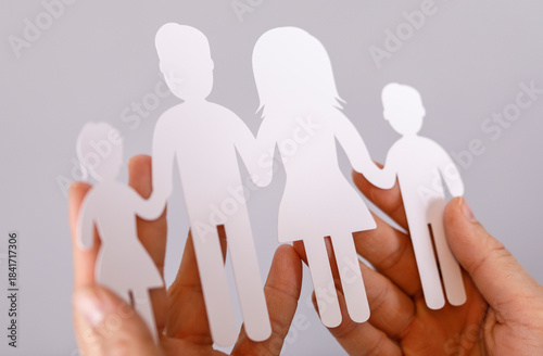 A paper cutout family held ...