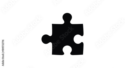 A stark black puzzle piece stands isolated on a white background forming a powerful silhouette