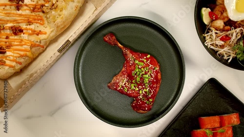 a hot duck leg spins on a plate