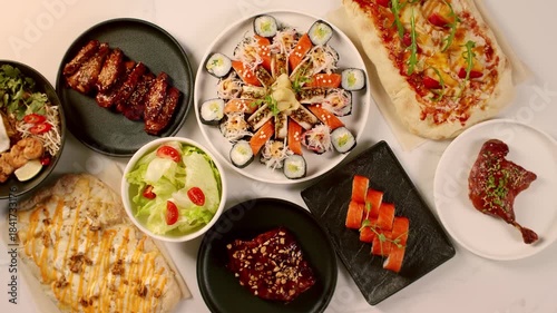 the chef puts a plate of food on the table