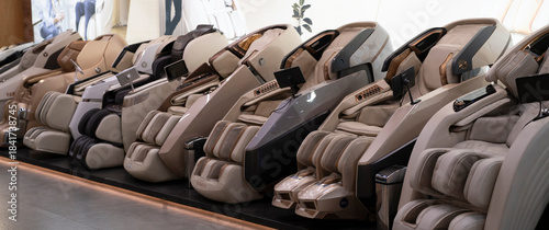 A store displays various massage chairs featuring different styles and functions for customers