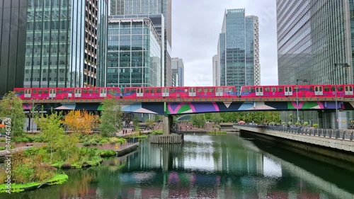 London, Time Lapse. DLR Train running over bridge in Canary Wharf. 2025