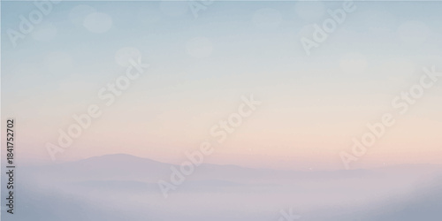 Golden sun rays pierce through shifting clouds during a breathtaking sunrise over the majestic mountain peaks