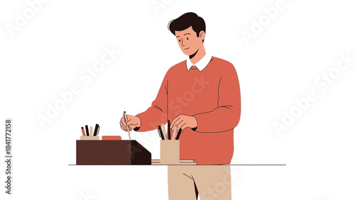 A man organizing pens and pencils on a table, preparing for writing or creative work