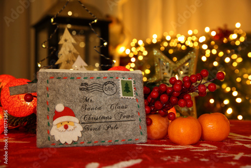 Vintage Santa Letter Amid Glowing Christmas Lights And Oranges