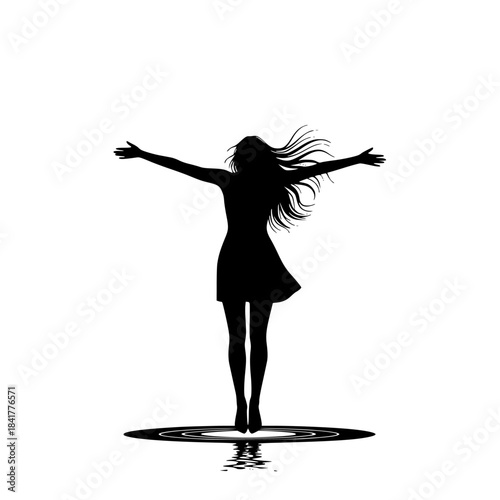 Silhouette of a girl in a dress with arms outstretched over a reflective water surface