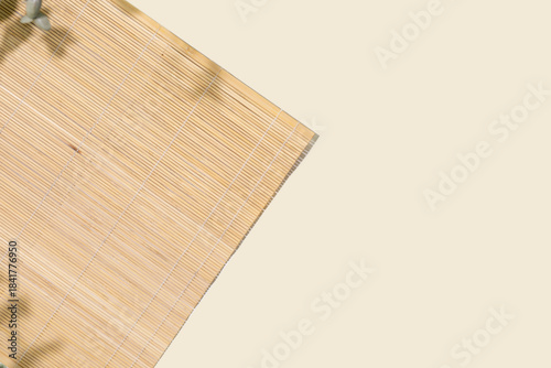 Background With Natural Bamboo Placemat On Neutral Backdrop With Soft Shadows. Ideal For Eco Branding, Product Mockups, Asian Cuisine Menus, Or Interior Design And Sustainable Living Concepts