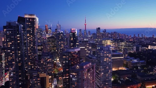 Drone view of the evening Toronto skyline. City lights. Downtown skyscrapers viewed from above. Toronto, Ontario, Canada.