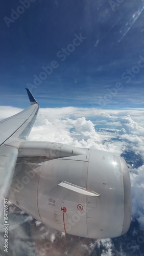 Airliner Wing View Above the Clouds