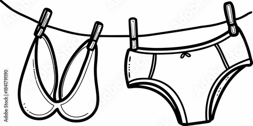Line drying lingerie a bra and panties hanging on a clothesline