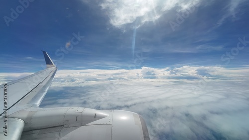 Airliner Wing View Above the Clouds
