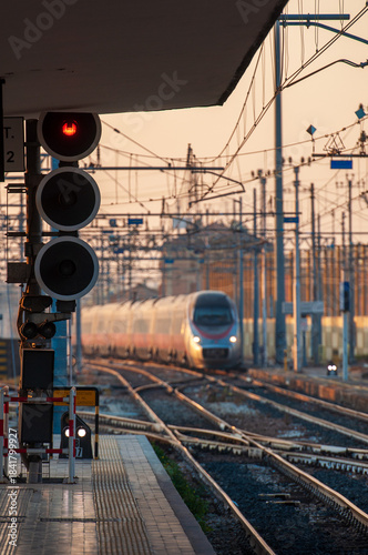 fast train arriving on the platform of a station