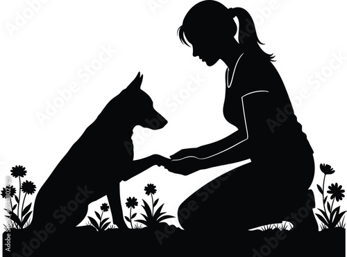 A tender moment of connection between a woman and her loyal dog in a beautiful silhouette design