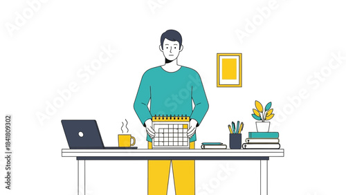 A Person Holding a Calendar at a Desk Workspace with a Laptop and Accessories