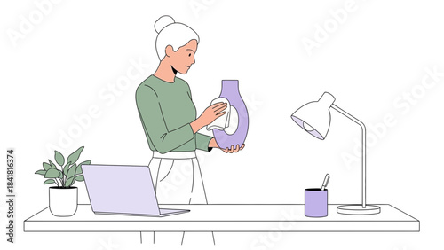 Woman Cleaning a Vase at Her Desk, with a Laptop, Plant, and Lamp Illustration