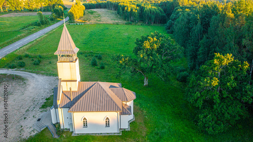 Aerial photo from drone to Igate church at sunset on a beautiful summer evening. Vidrizi, Limbazi, Latvia. (Series)