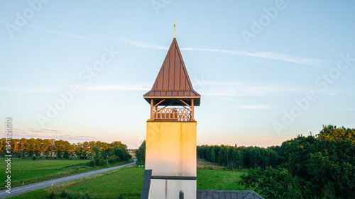Aerial photo from drone to Igate church at sunset on a beautiful summer evening. Vidrizi, Limbazi, Latvia. (Series)