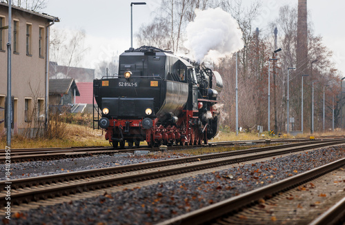 old steam train Dampflok with a lot of steam in saxony bischofswerda 528141-5 Dampflok