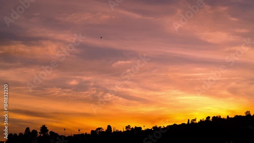 Timelapse of epic sunset sky afterglow over the hills in Los Angeles, California, USA