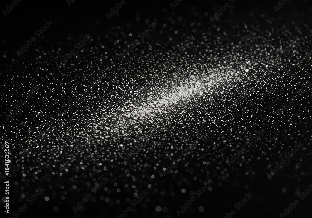 Obraz premium Close up macro shot of fine white powder scattered randomly across a dark, textured background surface creating a contrasting abstract pattern ,scattered ,dispersed ,macro